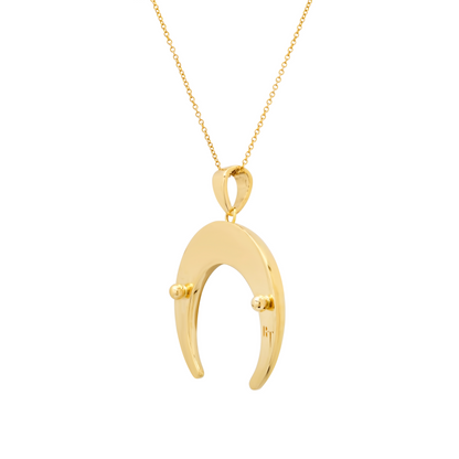 Gold crescent moon pendant necklace with decorative beads on a delicate chain.